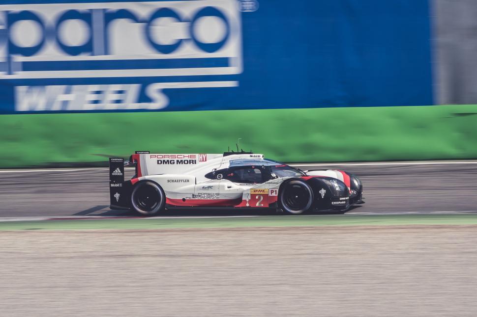 Free Image of Race Car Speeding Down Race Track 
