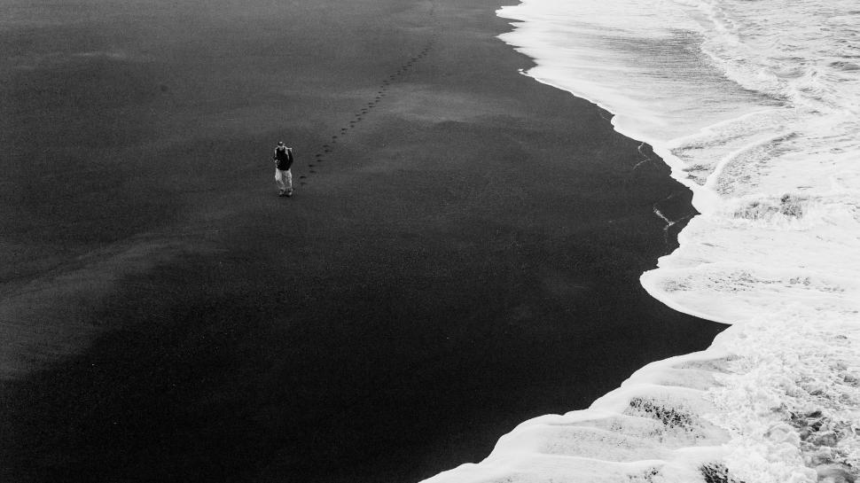 Free Image of Person Walking on Beach 