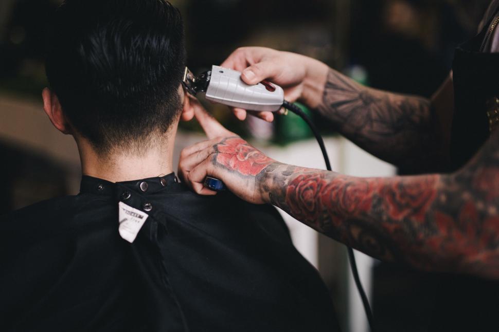 man-getting-haircut-at-barber-shop.jpg