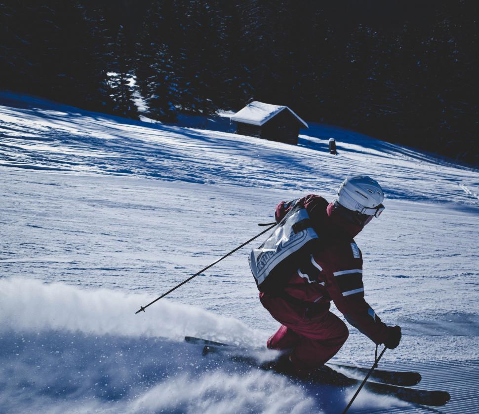 Free Image of Man Skiing Down Snow Covered Slope 