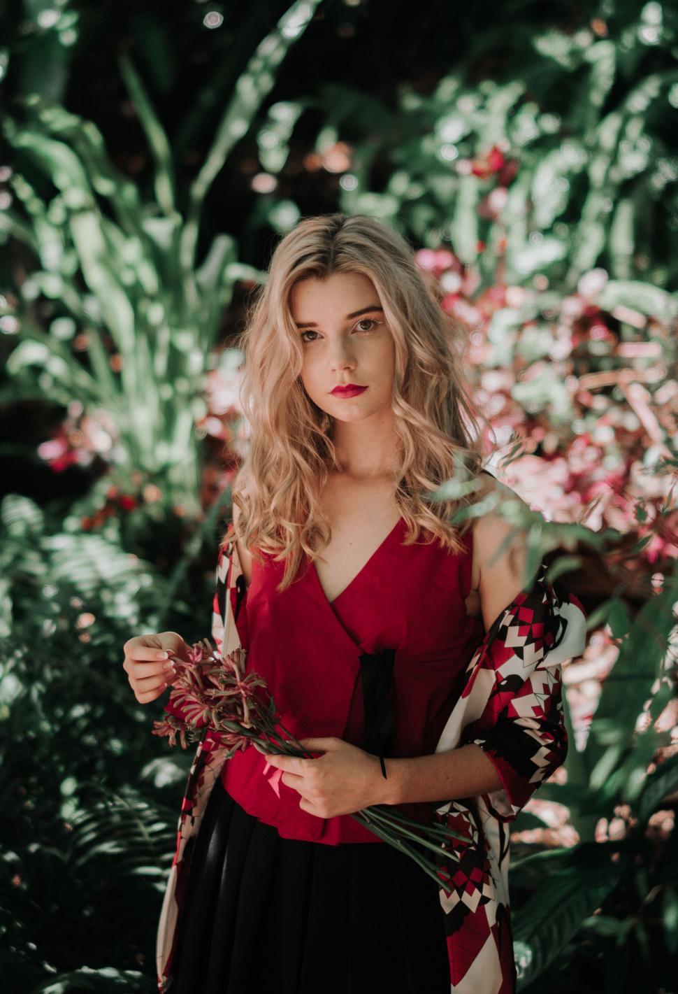 Free Image of Woman in Red Top Standing in Forest 