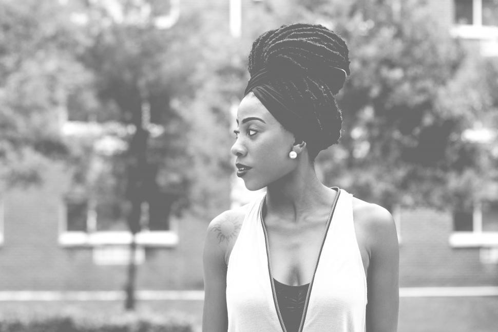 Free Image of Woman in White Top, Black and White Background 