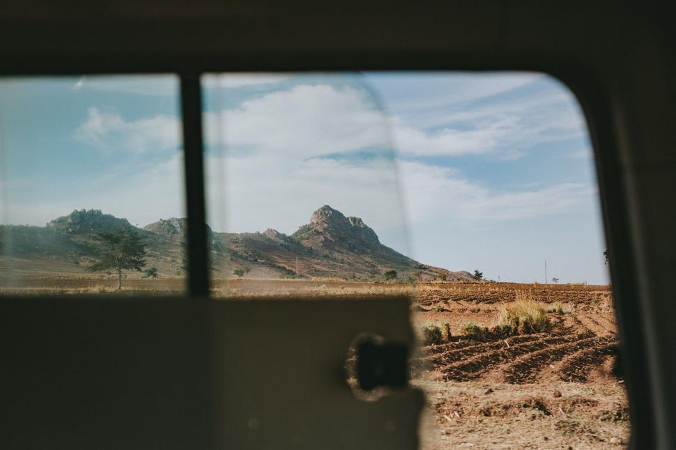 Free Image of View of Dirt Field Through Window 