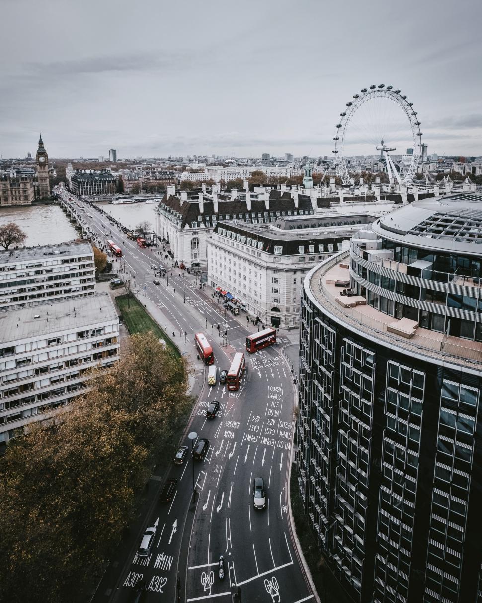 Free Image of Urban Cityscape With Ferris Wheel 