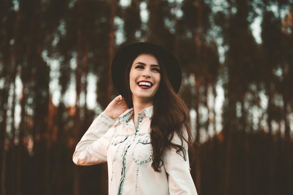 Free Image of Woman Wearing Hat and White Shirt 