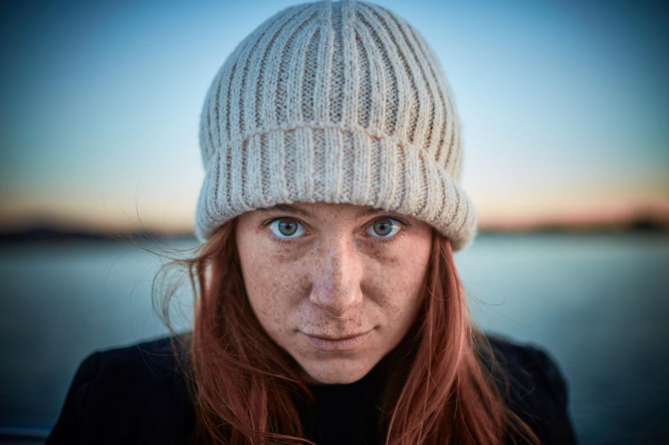 Free Image of Woman With Red Hair Wearing White Hat 
