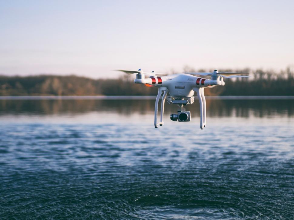 Free Image of Large White Bird Flying Over Body of Water 
