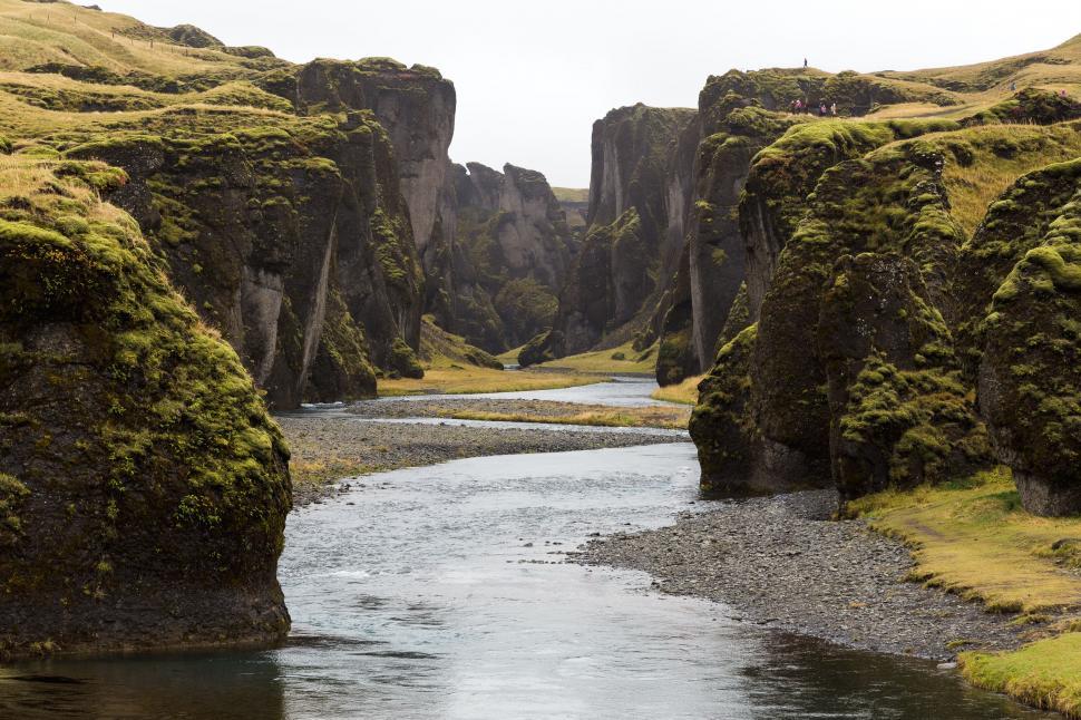 Free Image of River Flowing Through a Lush Green Valley 