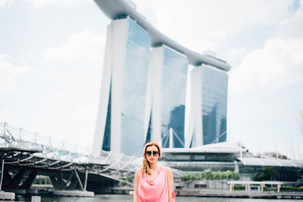 Free Image of Woman Standing by Body of Water 