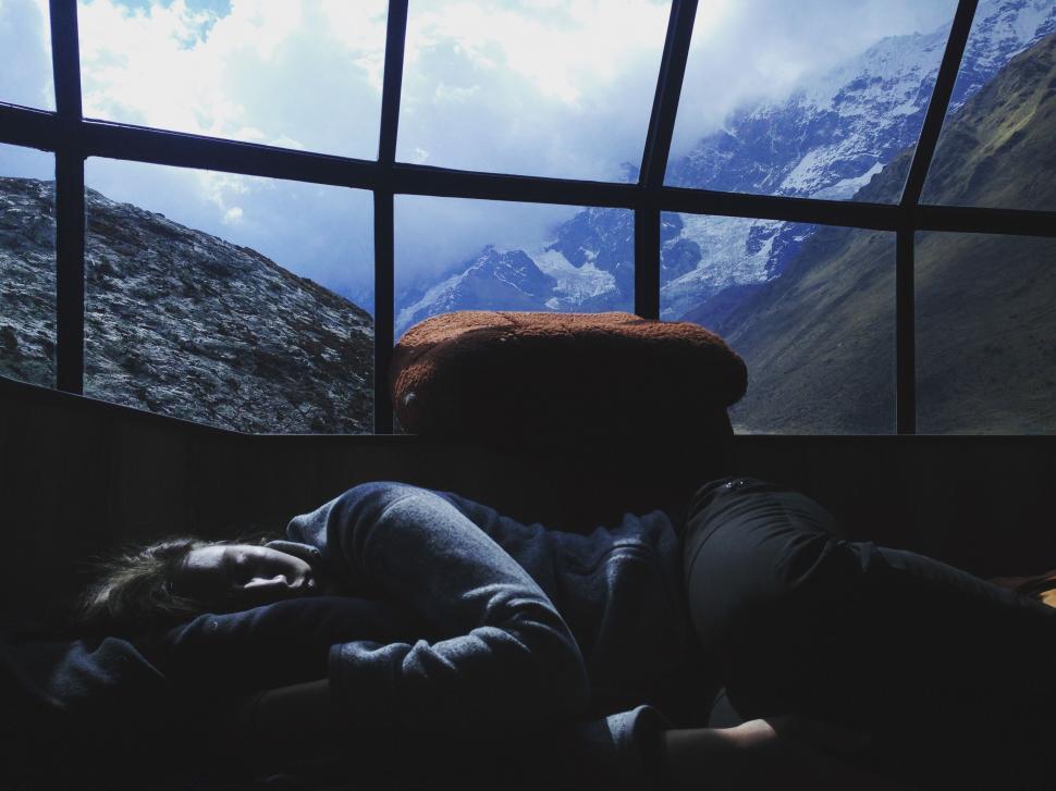 person-laying-on-bed-in-front-of-window.jpg