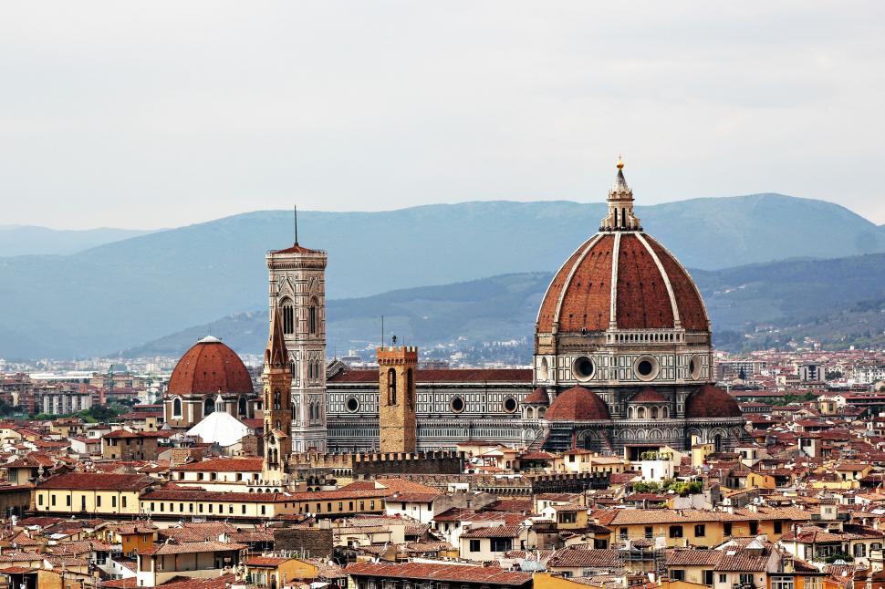 Free Image of City Skyline With Dome and Mountains 