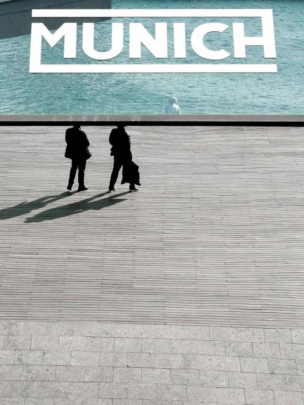 Free Image of People Standing on Sidewalk 