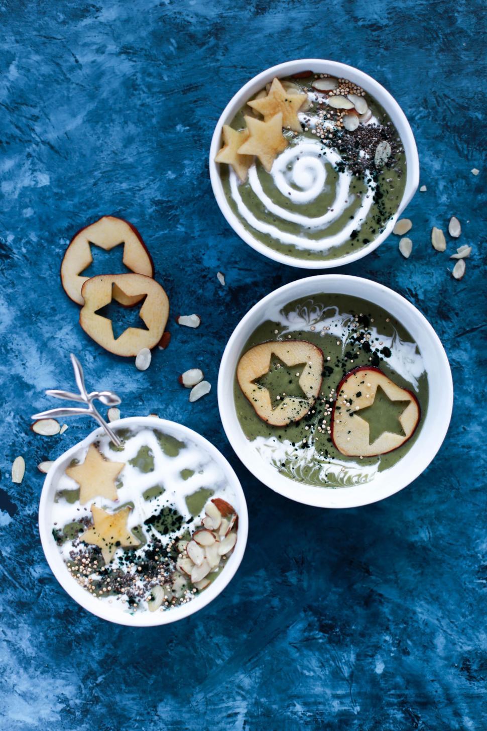 Free Image of Three Bowls Filled With Food on Blue Surface 
