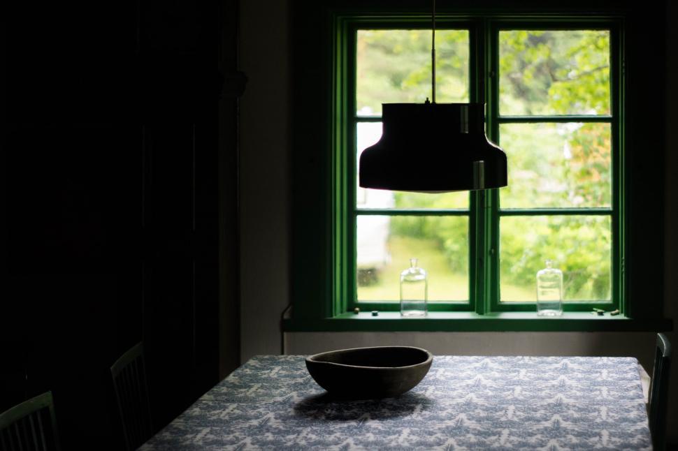 Free Image of Bowl Resting on Table by Window 
