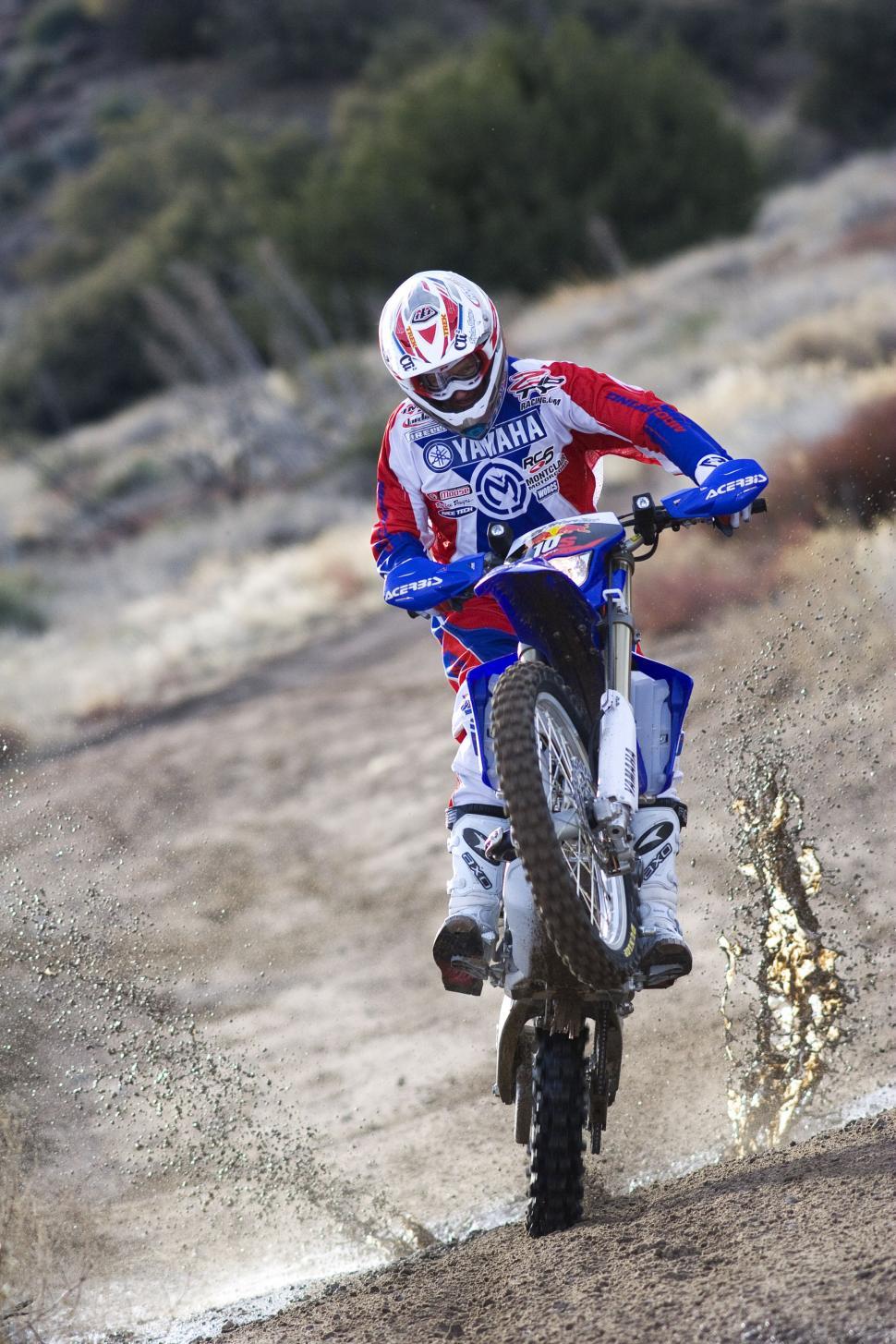 Free Image of Man Riding Dirt Bike on Dirt Field 
