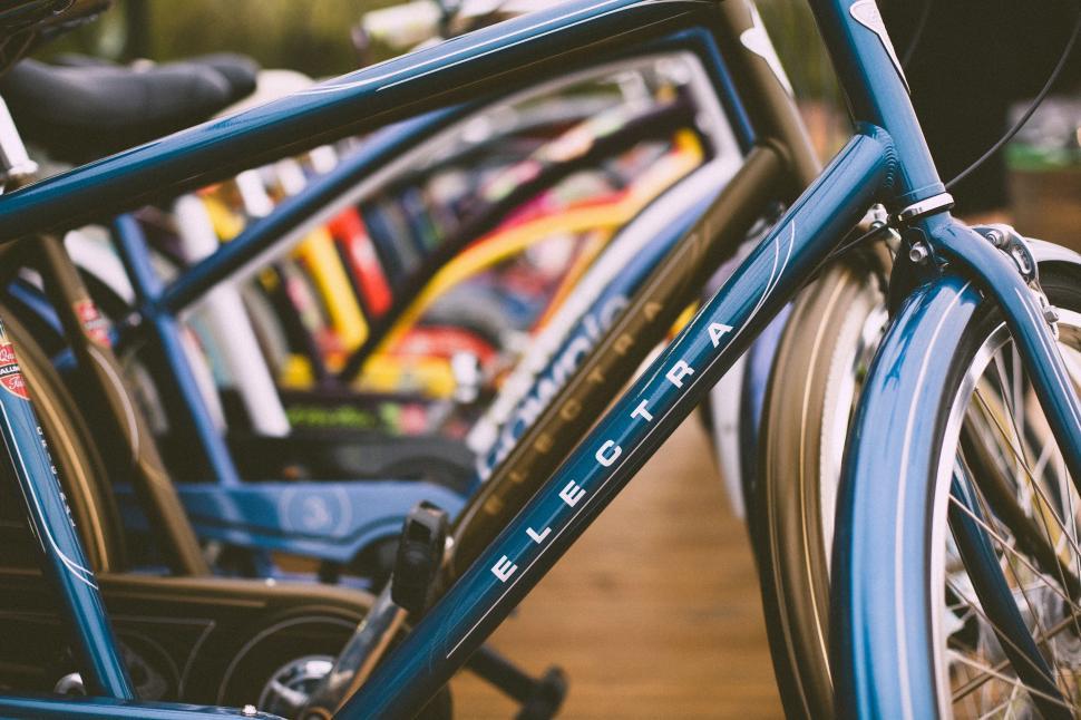 Free Image of Close Up of a Bicycle Parked on Wooden Floor 