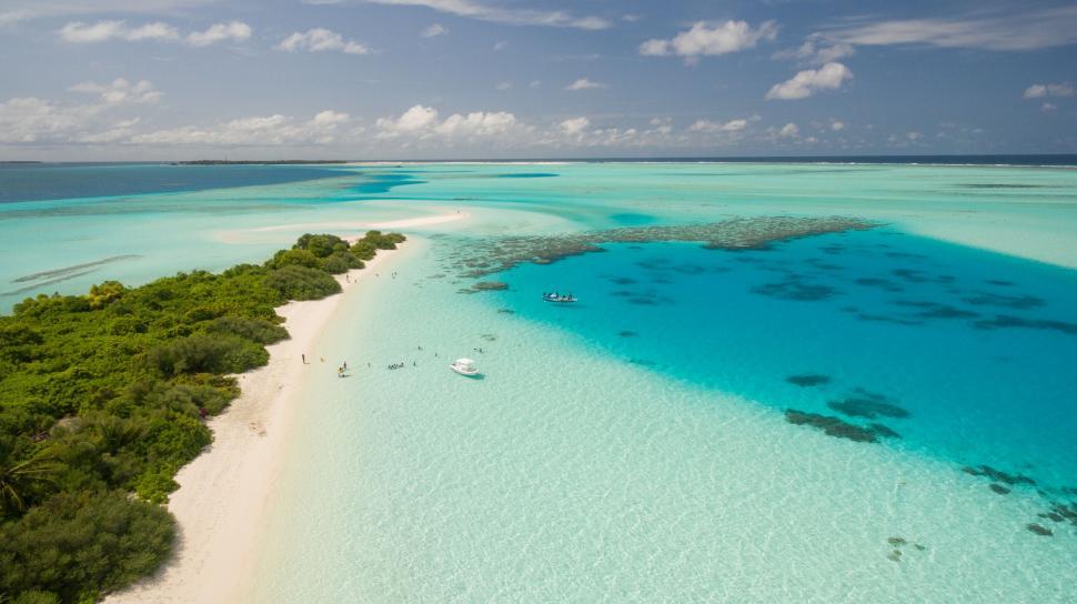 Free Image of Aerial View of a Beach With a Boat 