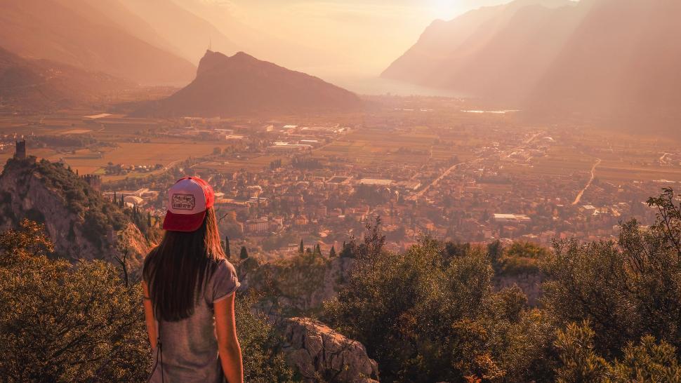 Free Image of Woman Standing on Mountain Overlooking Valley 