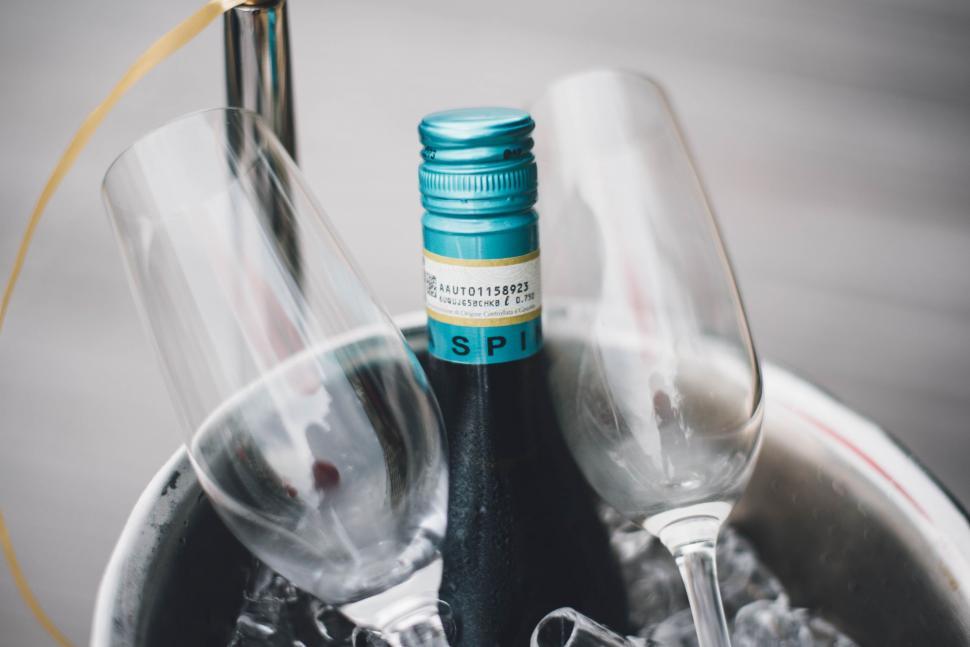 Free Image of Bottle of Wine and Two Wine Glasses in a Bucket 