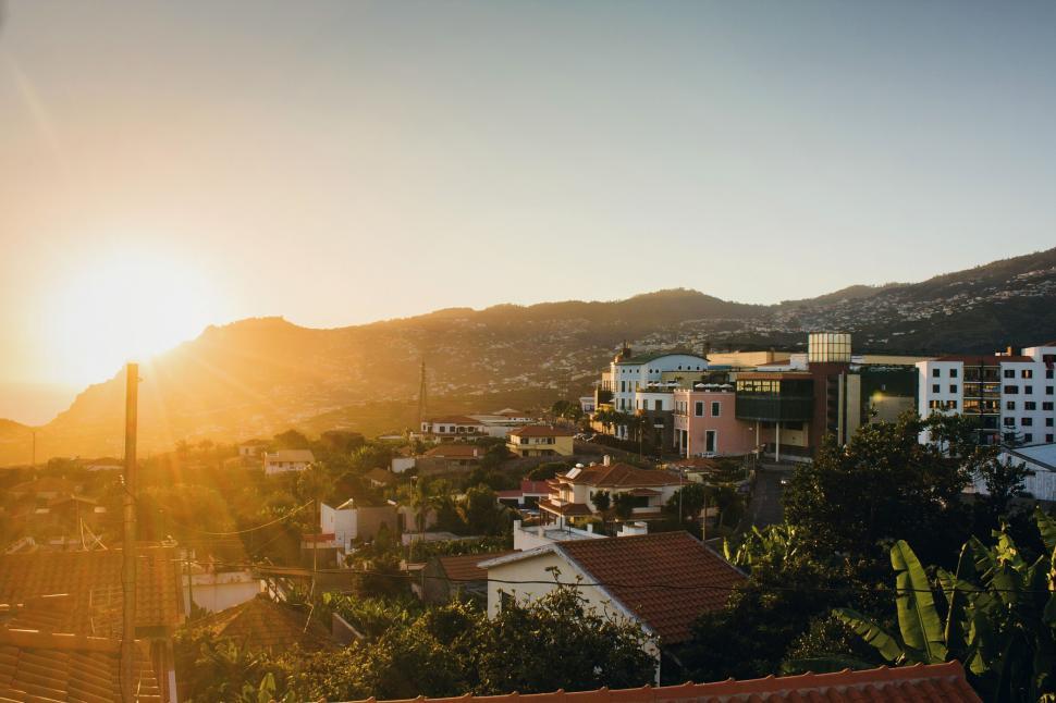 Free Image of Cityscape With Mountains in Background 