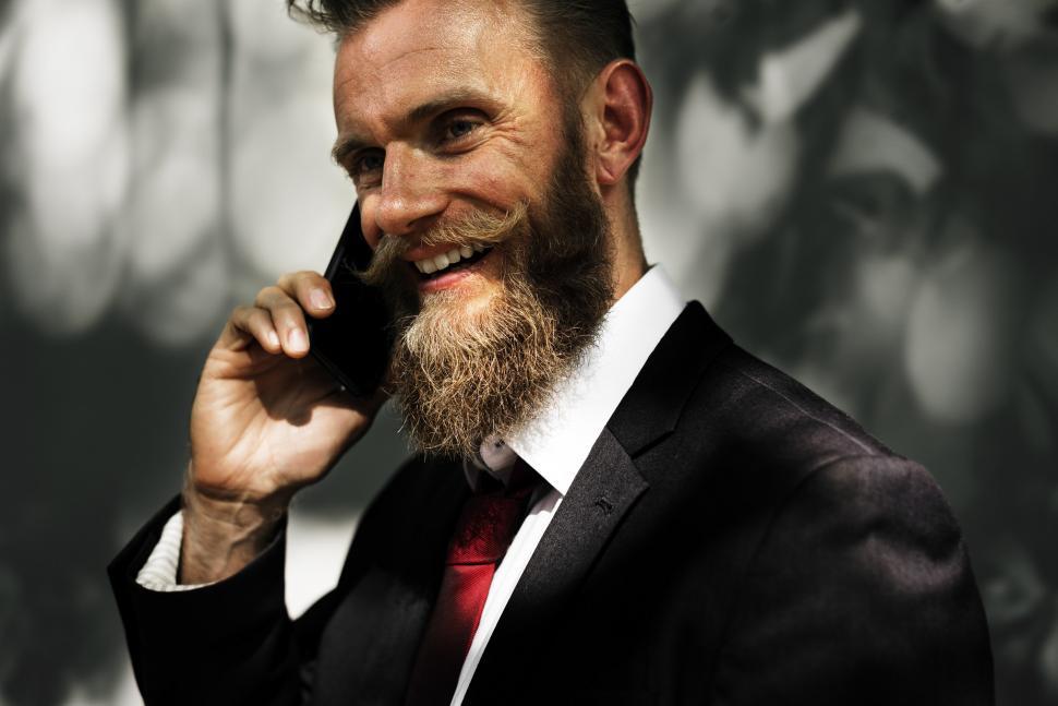 Free Image of Businessman in Suit Talking on Cell Phone 