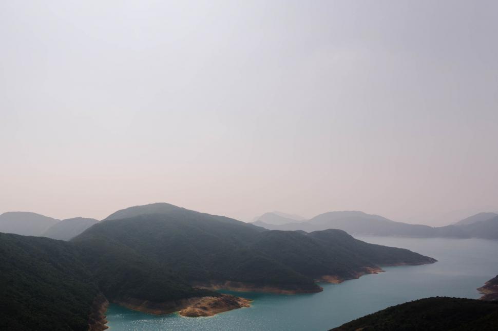 Free Image of Majestic Lake Surrounded by Towering Mountains 
