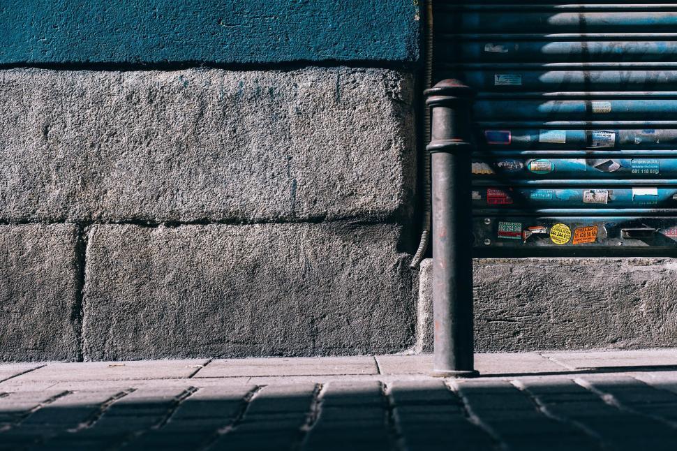 Free Image of Bench Next to Blue Wall 