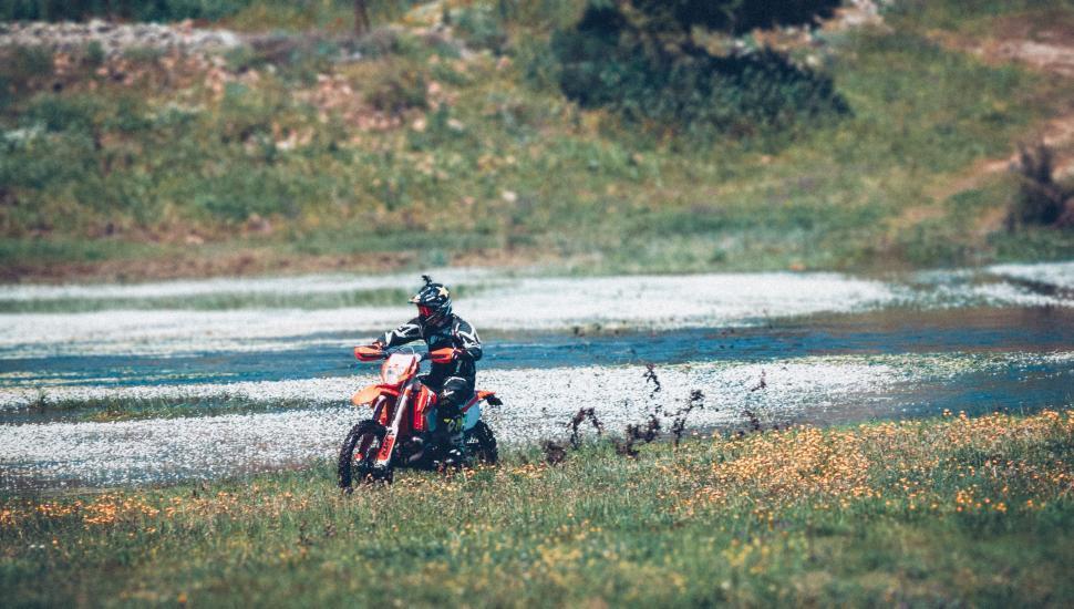 Free Stock Photo of Person Riding Motorcycle on Wet Road Download