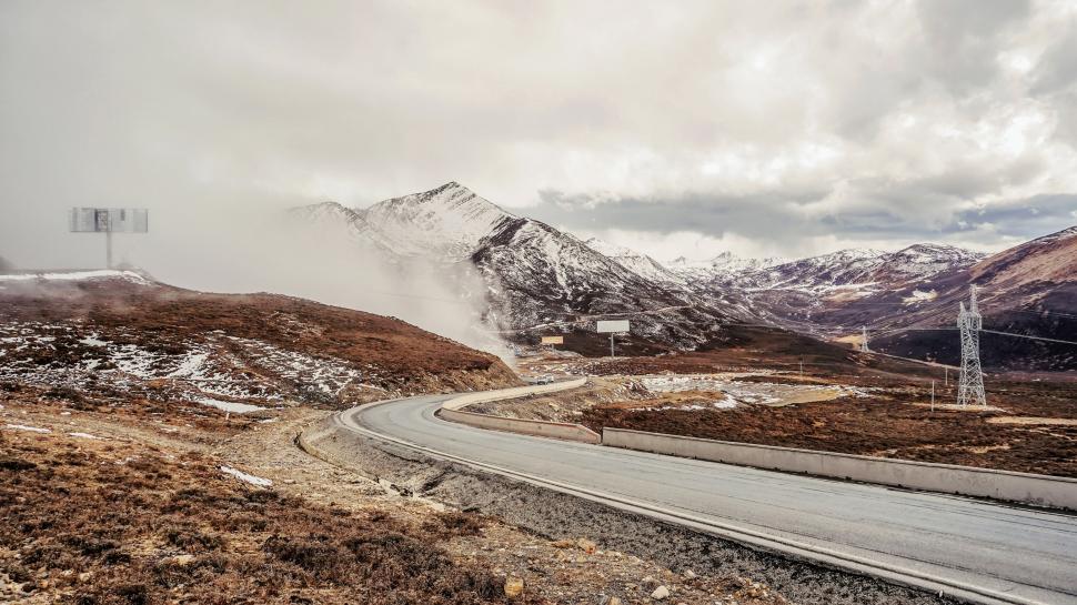 Free Image of A Winding Road Through a Mountain Range 