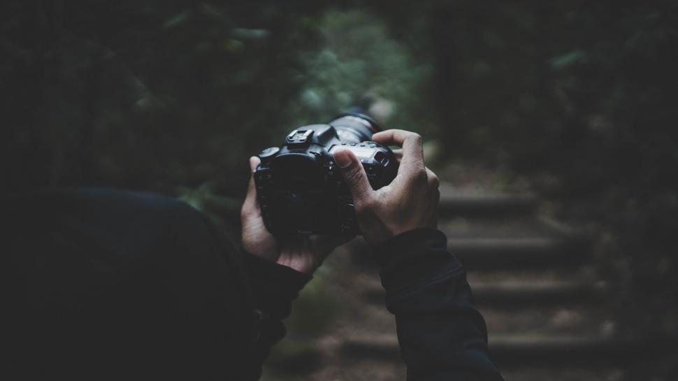 Free Image of Person Taking a Picture With a Camera 