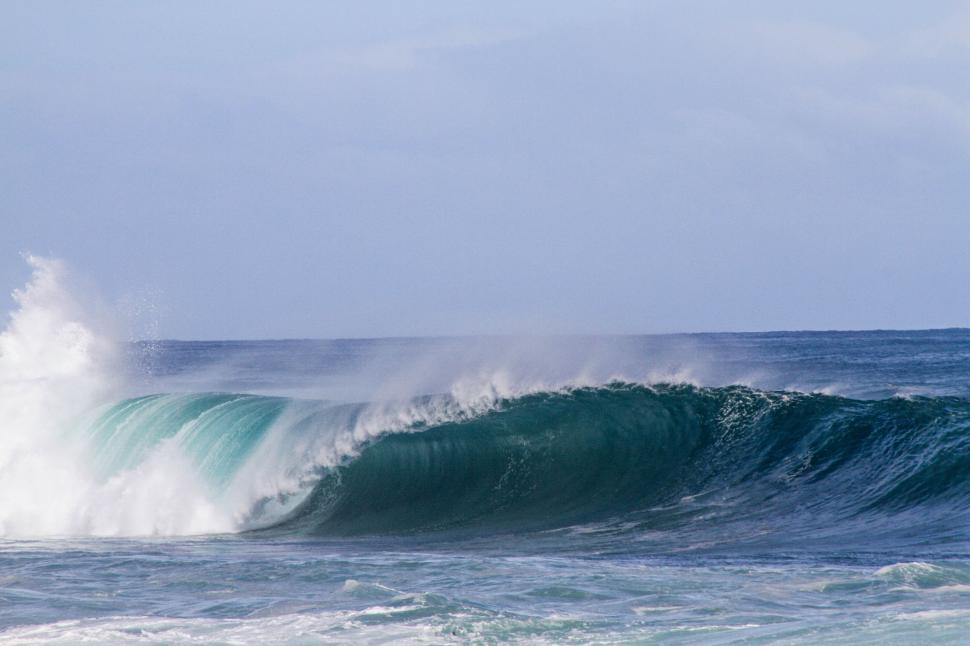 Free Image of Man Riding Wave on Surfboard 