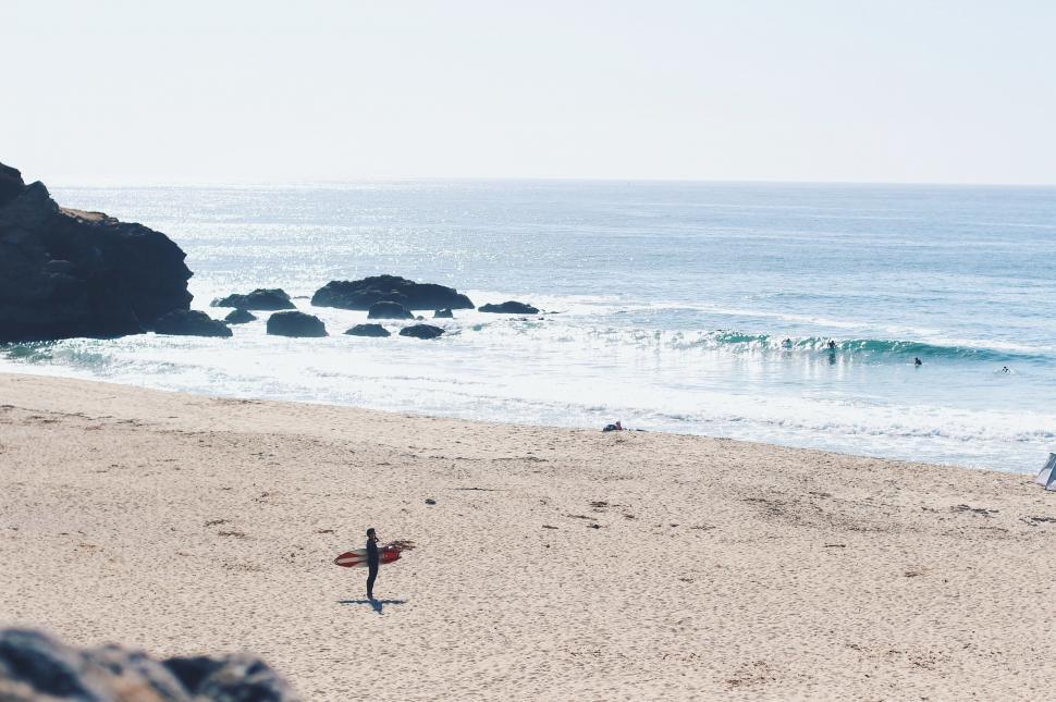 Free Image of Surfboard Resting on Sandy Beach 