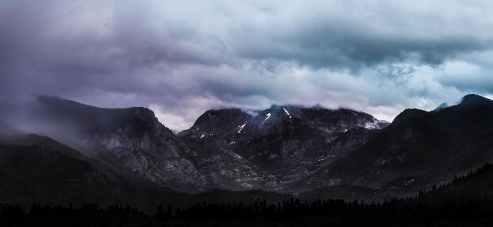 Free Image of Majestic Mountain Range Under Cloudy Sky 