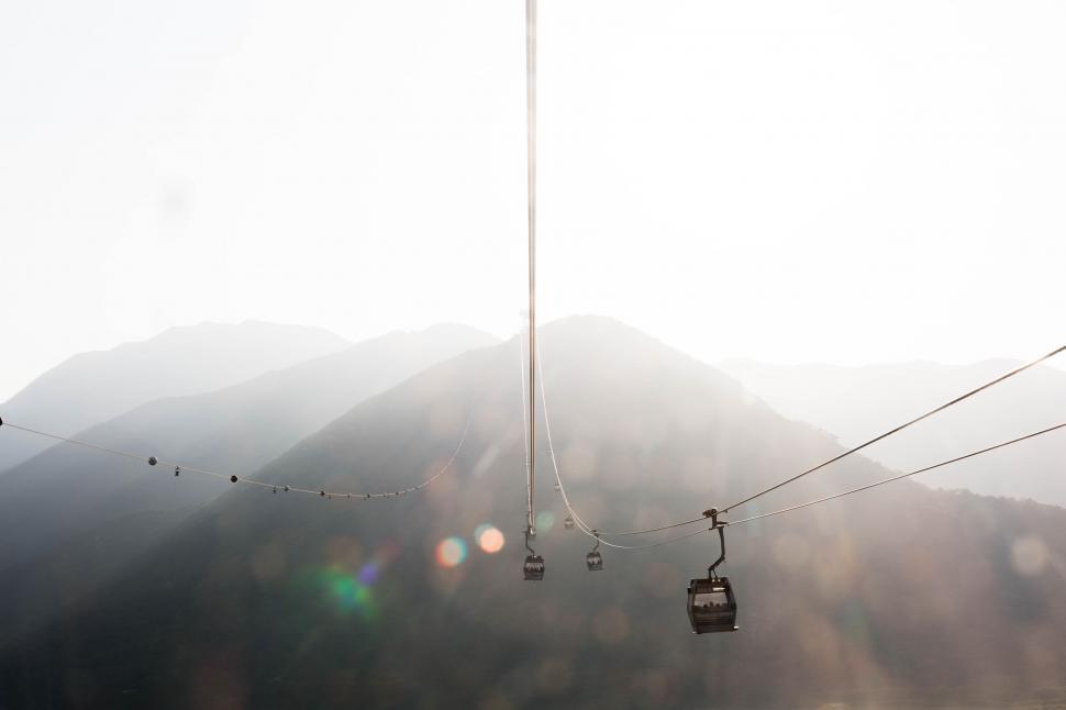 Free Image of Ski Lift Ascending Mountain With Background Mountains 