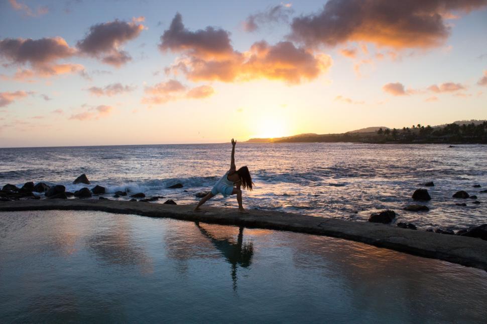 Free Image of Person Performing Handstand on Pool Edge 