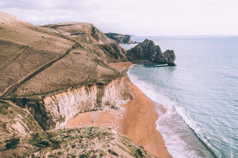 Free Image of Beach View With Rock Outcropping 