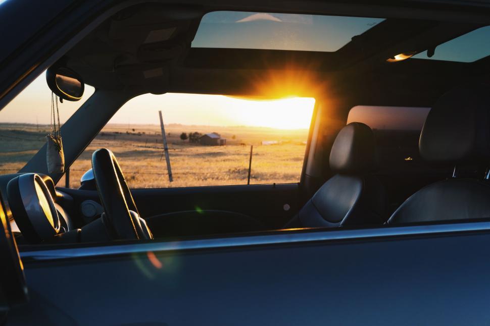 Free Image of Sun Setting in Back of Truck 