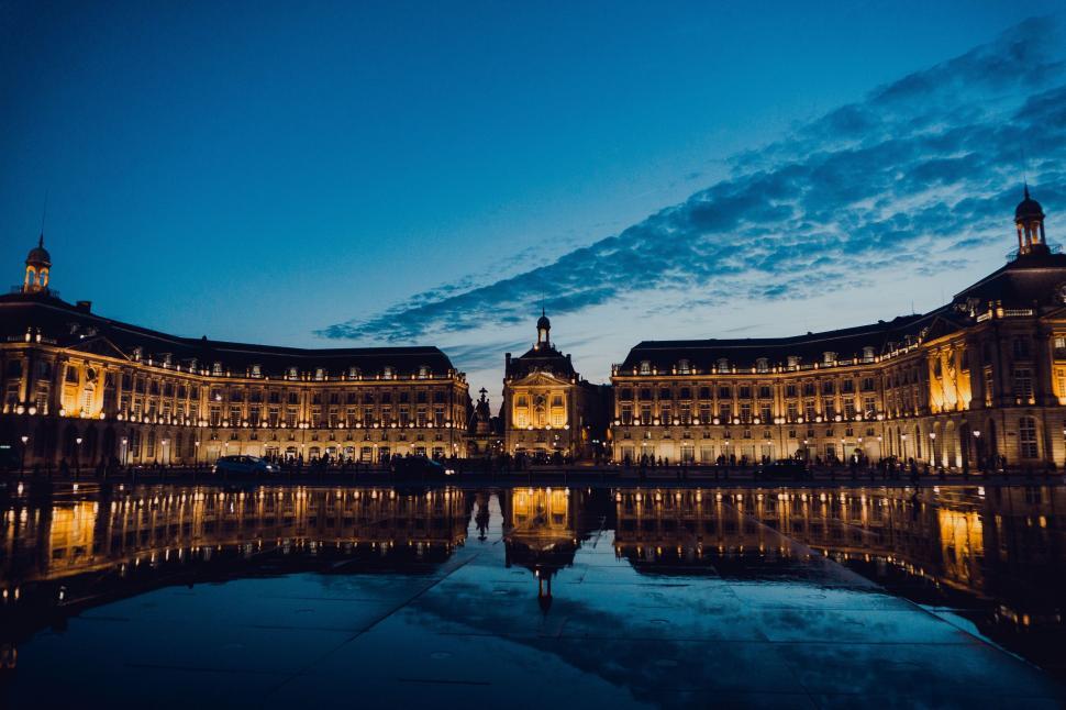 Free Image of Urban Building Reflecting in Water 