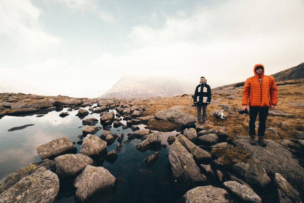 Free Image of Couple Standing on Rocky Hillside 