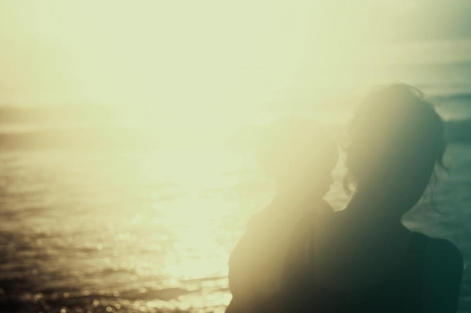 Free Image of Person Standing in Front of Water Body 