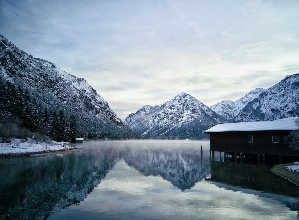 Free Image of Snow Covered Mountains Surrounding Lake 