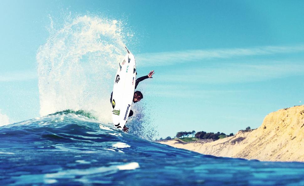 Free Image of Man Riding Surfboard on Top of Wave in Ocean 