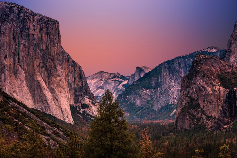 Free Image of Majestic Mountain Range With Trees in Background 