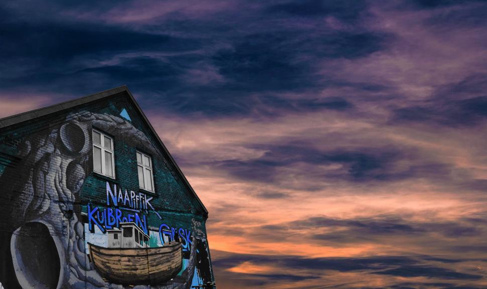Free Image of Boat Painting Adorning Building Facade 