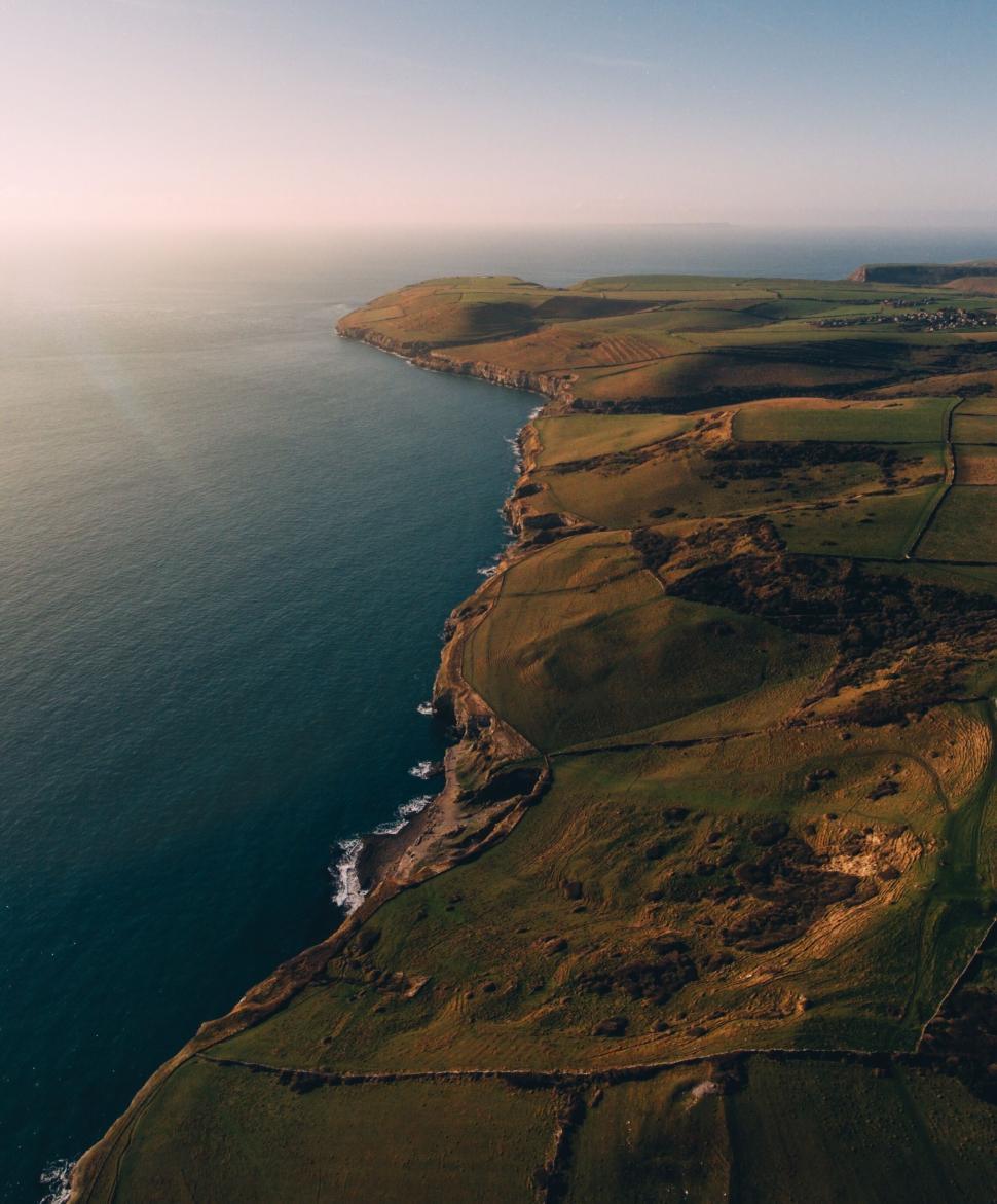 Free Image of Vast Body of Water in Surrounding Land 