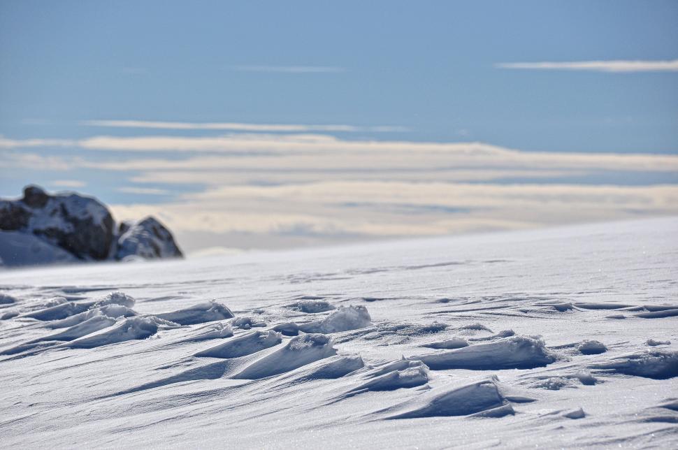 Free Image of Man Skiing Down Snow Covered Slope 