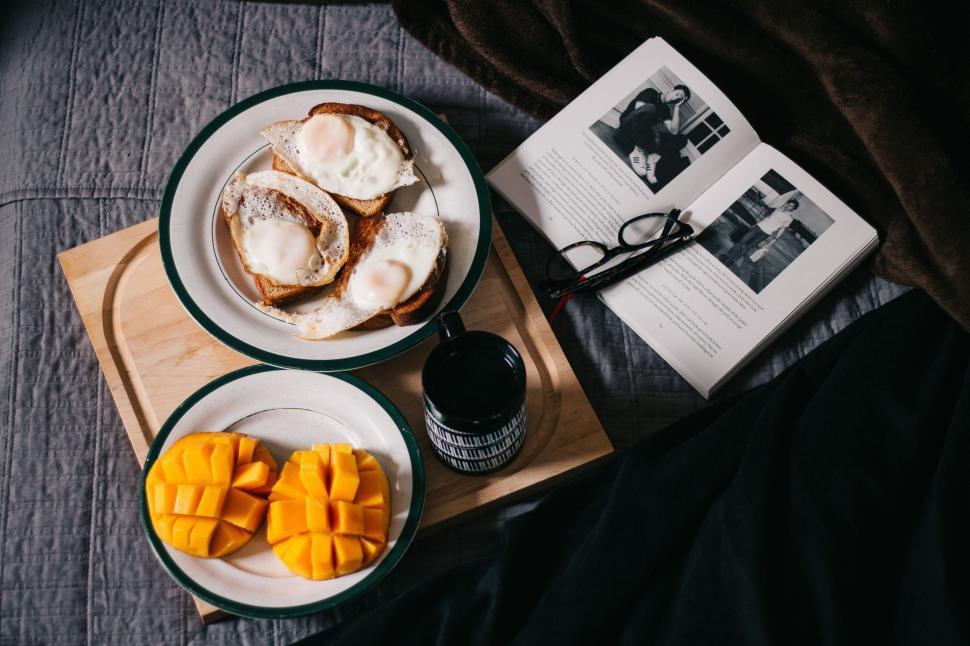 Free Image of Table Set With Plates of Food and a Book 