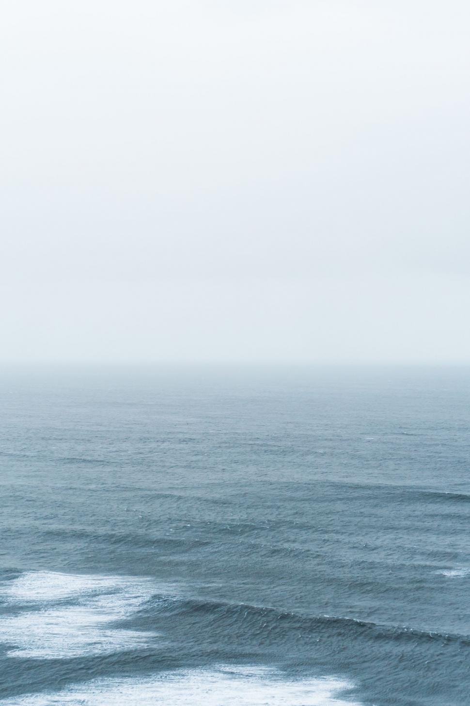 Free Image of Person Riding Surfboard on Wave in Ocean 