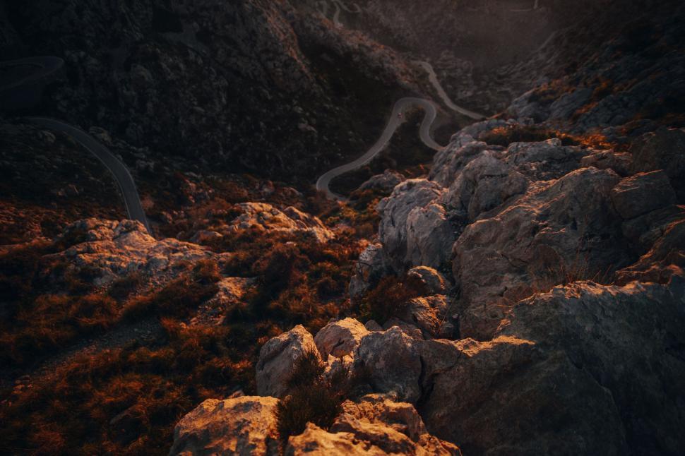Free Image of Long Road Running Through Rocky Area 