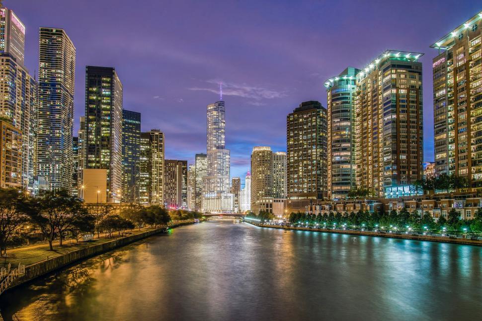 Free Image of River Running Through Large City at Night 